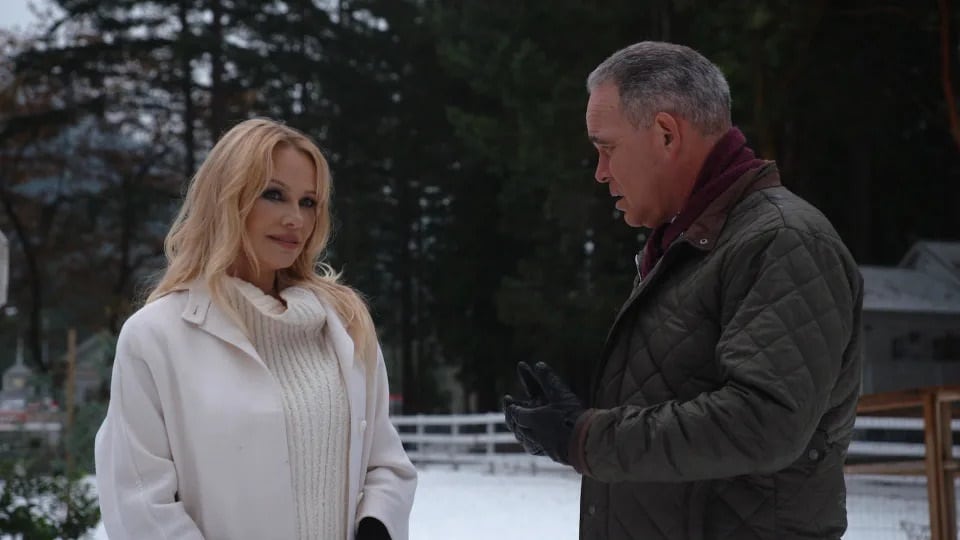 Pamela Anderson with correspondent Jim Axelrod. Credit CBS News 1