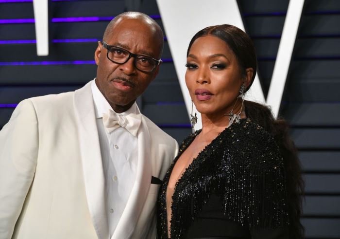 a picture of angela bassett and her husband
